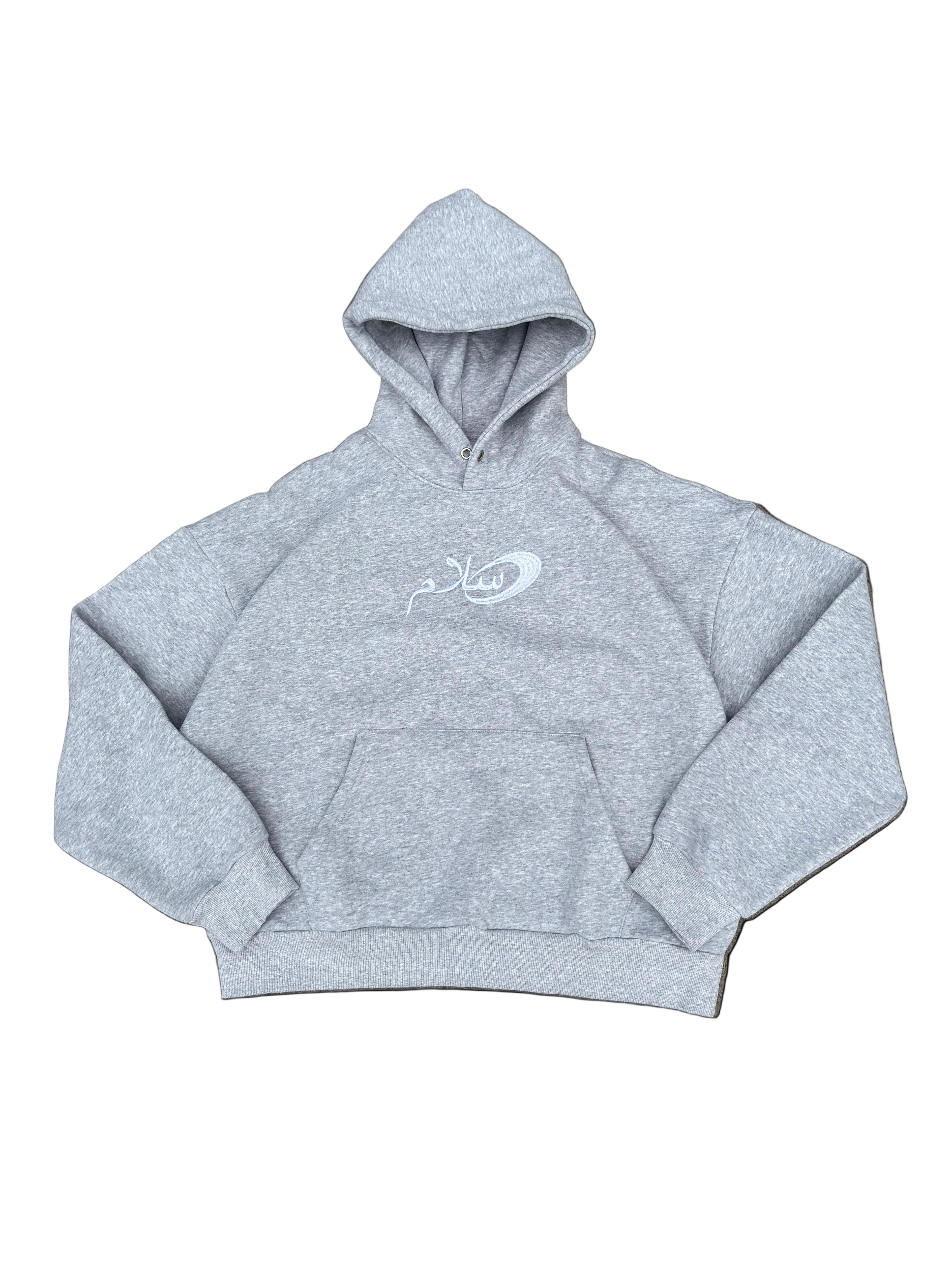Gray hoodie with a logo on a black background